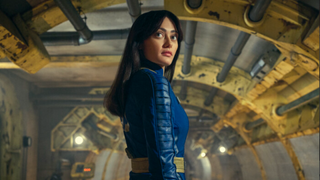 Lucy looking over her shoulder while standing in a Vault