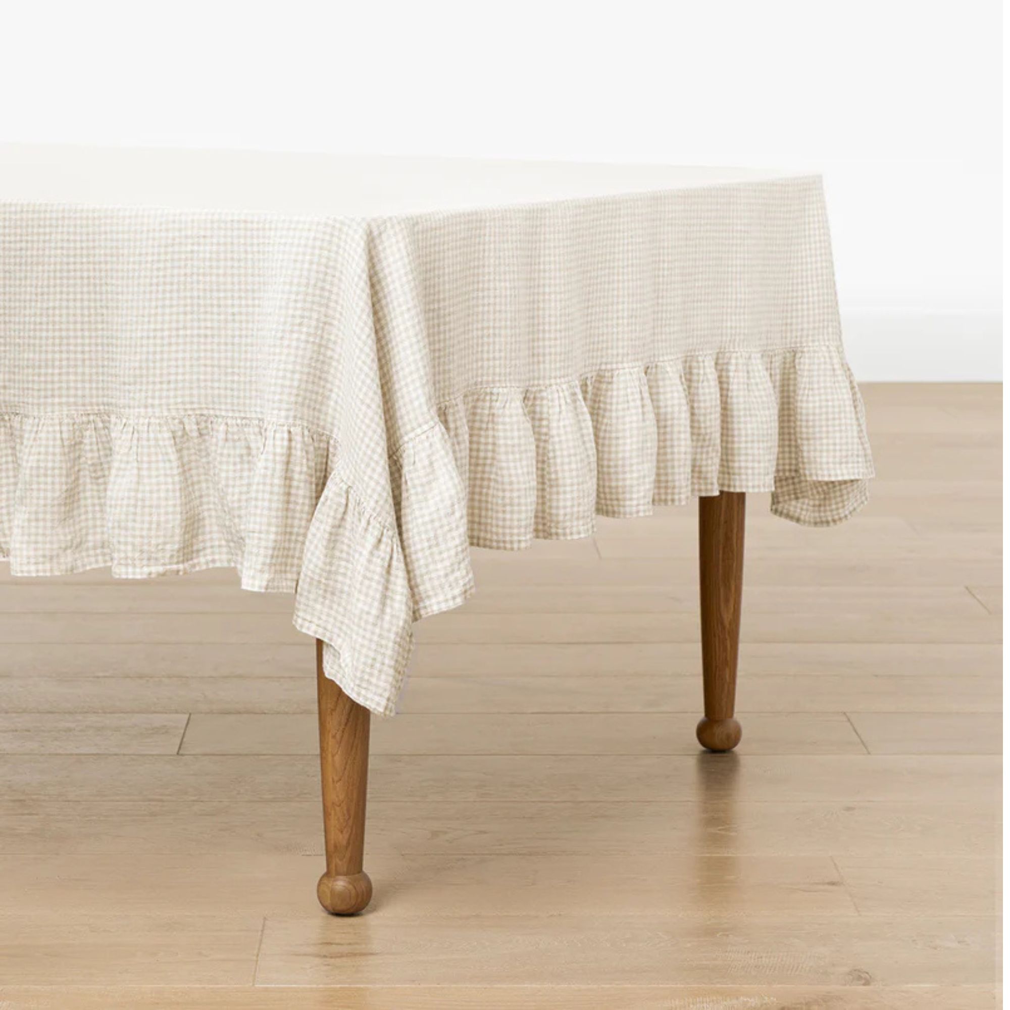 Cream and white gingham tablecloth with ruffle hem