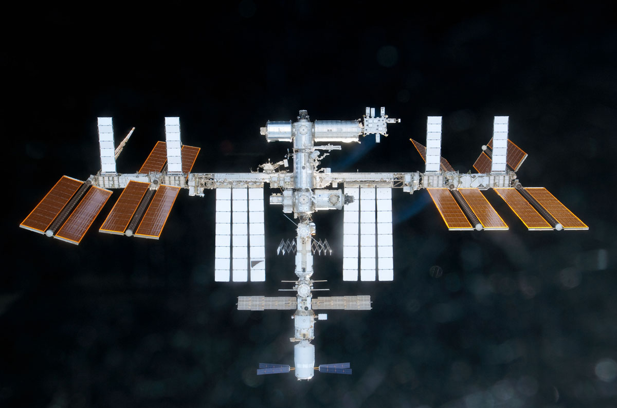 The International Space Station is featured in this image photographed by an STS-133 crew member on space shuttle Discovery as the shuttle approaches the station during rendezvous and docking operation on Feb. 27, 2011.