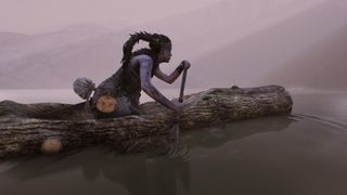Woman paddling a log through water