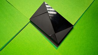NVIDIA Shield TV Pro against green background