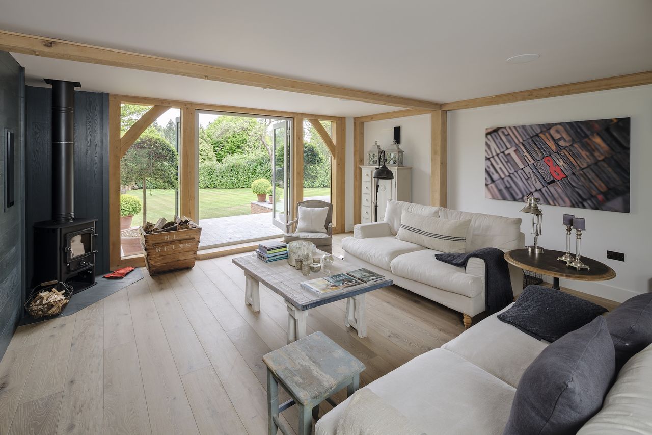 oak frame living rom with view towards the garden