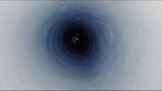 Here, the view down the borehole at about 3,500 feet (1,070 meters) below the ice, just above the surface of the subglacial lake in Antarctica.