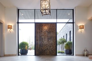 metallic front door with large glass surround