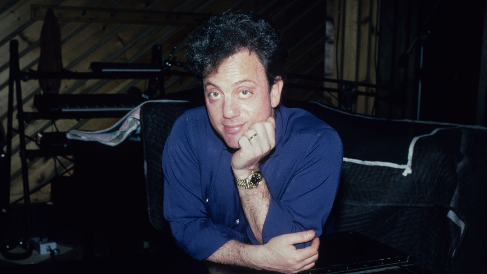 billy joel in the recording studio looking at the camera