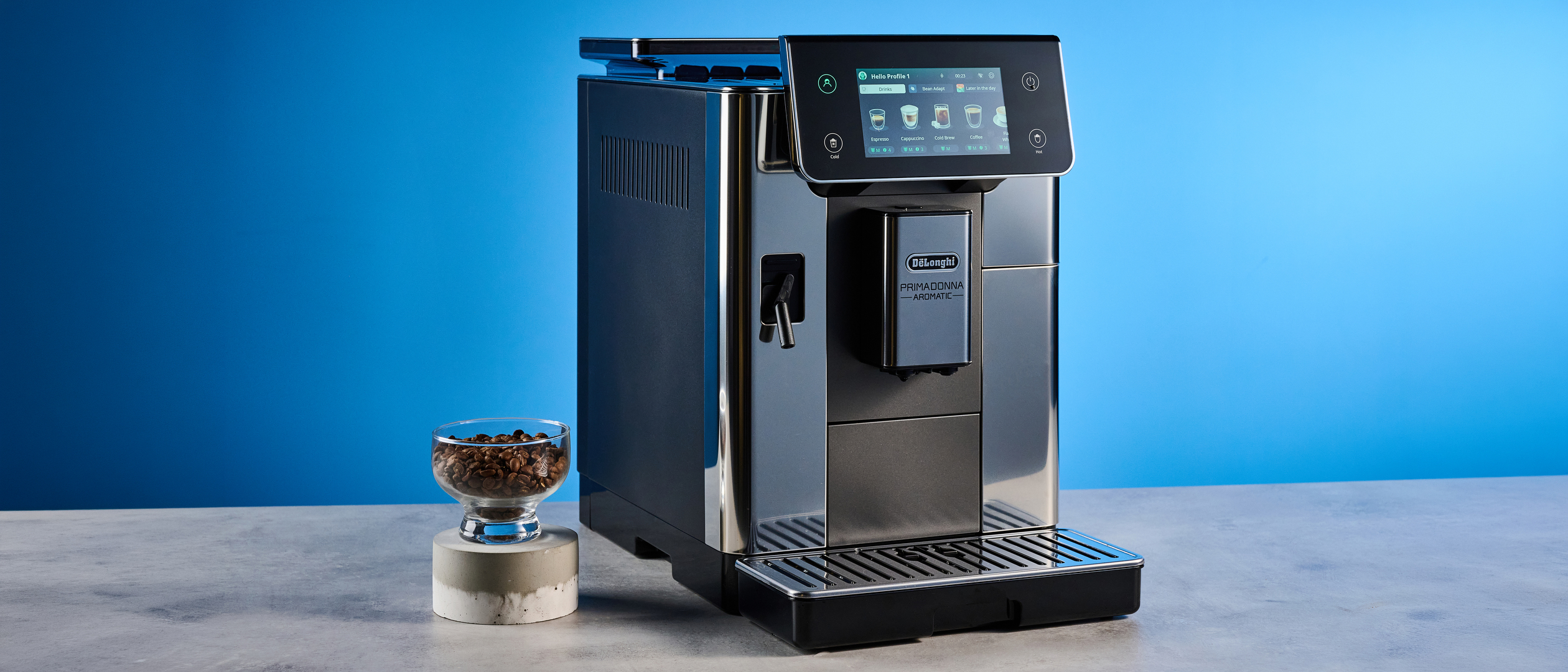 the de'longhi primadonna aromatic photographed against the blue tom's guide background
