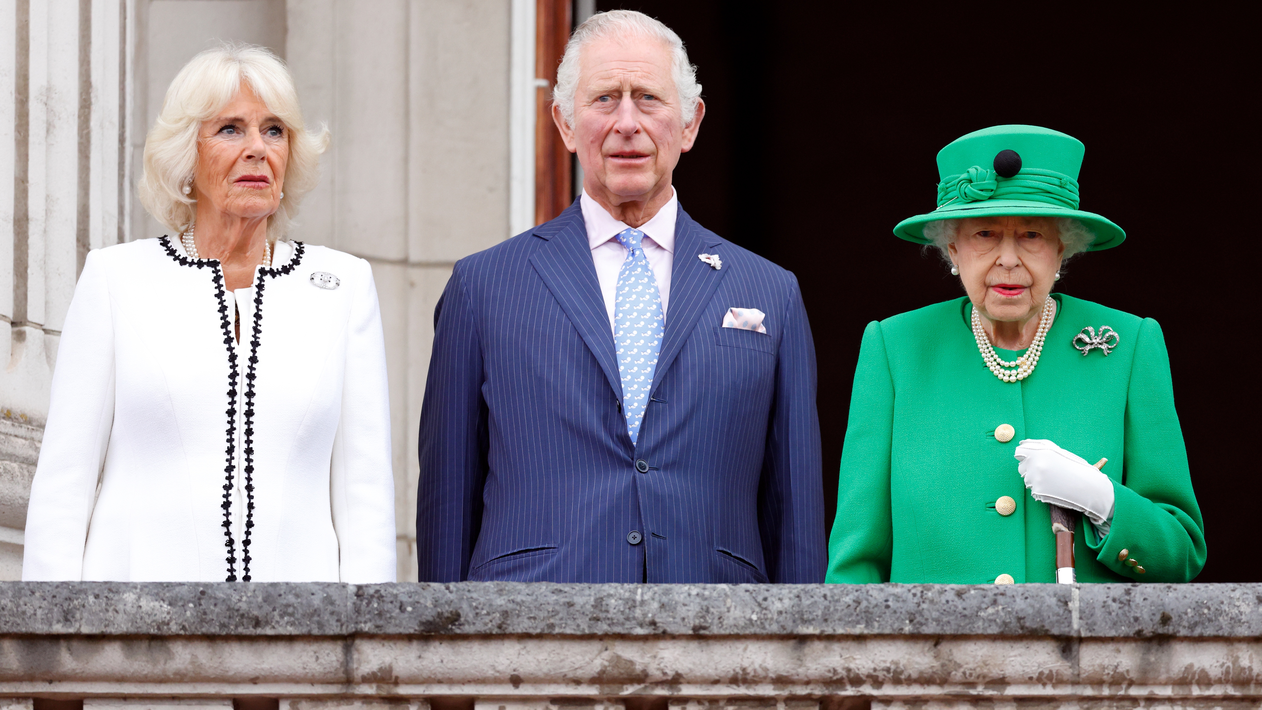Queen Camilla, King Charles and Queen Elizabeth II stand on the balcony of Buckingham Palace following the Platinum Pageant on June 5, 2022