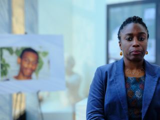 Stephen: Doreen Lawrence (Sharlene Whyte) stands in front of a picture of her murdered son Stephen