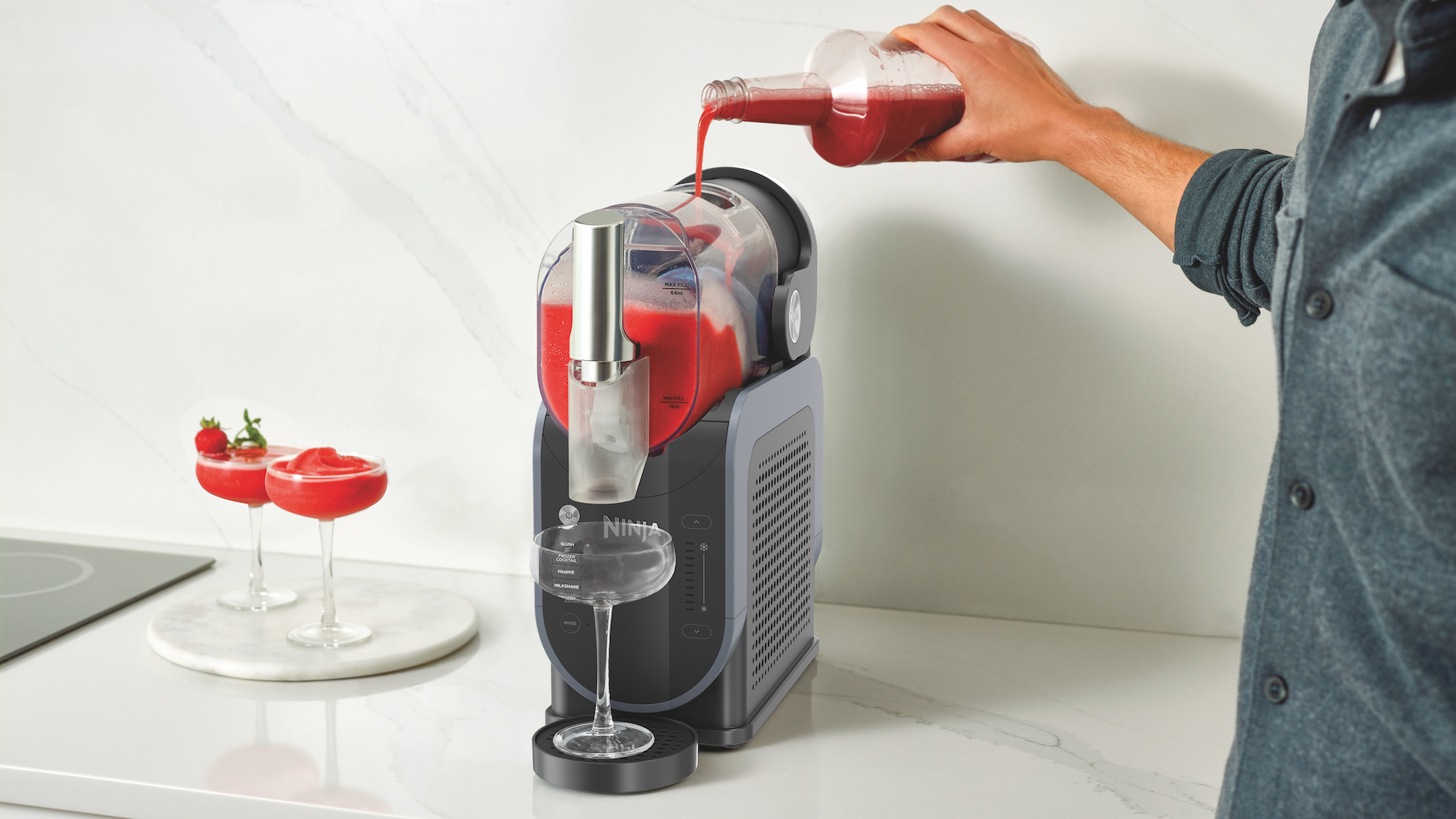 Man pouring drink from Ninja slushie machine