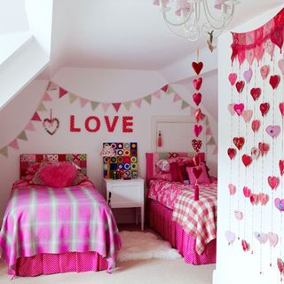 children room with pink bedsheet