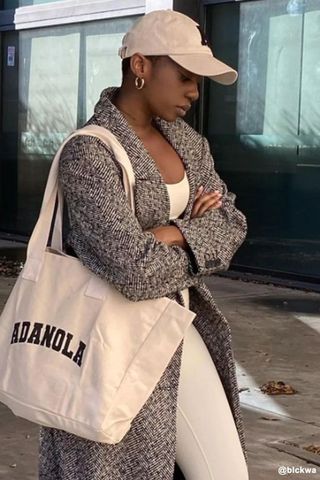 adanola knit sweatshirt woman wearing ada tote bag