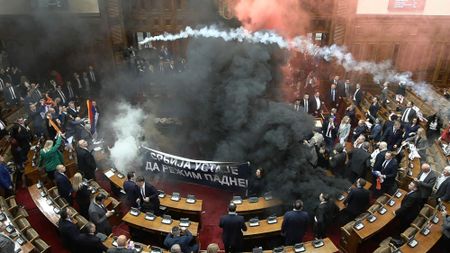 Smoke bombs and flares in Serbia's parliamentary chamber, in Belgrade