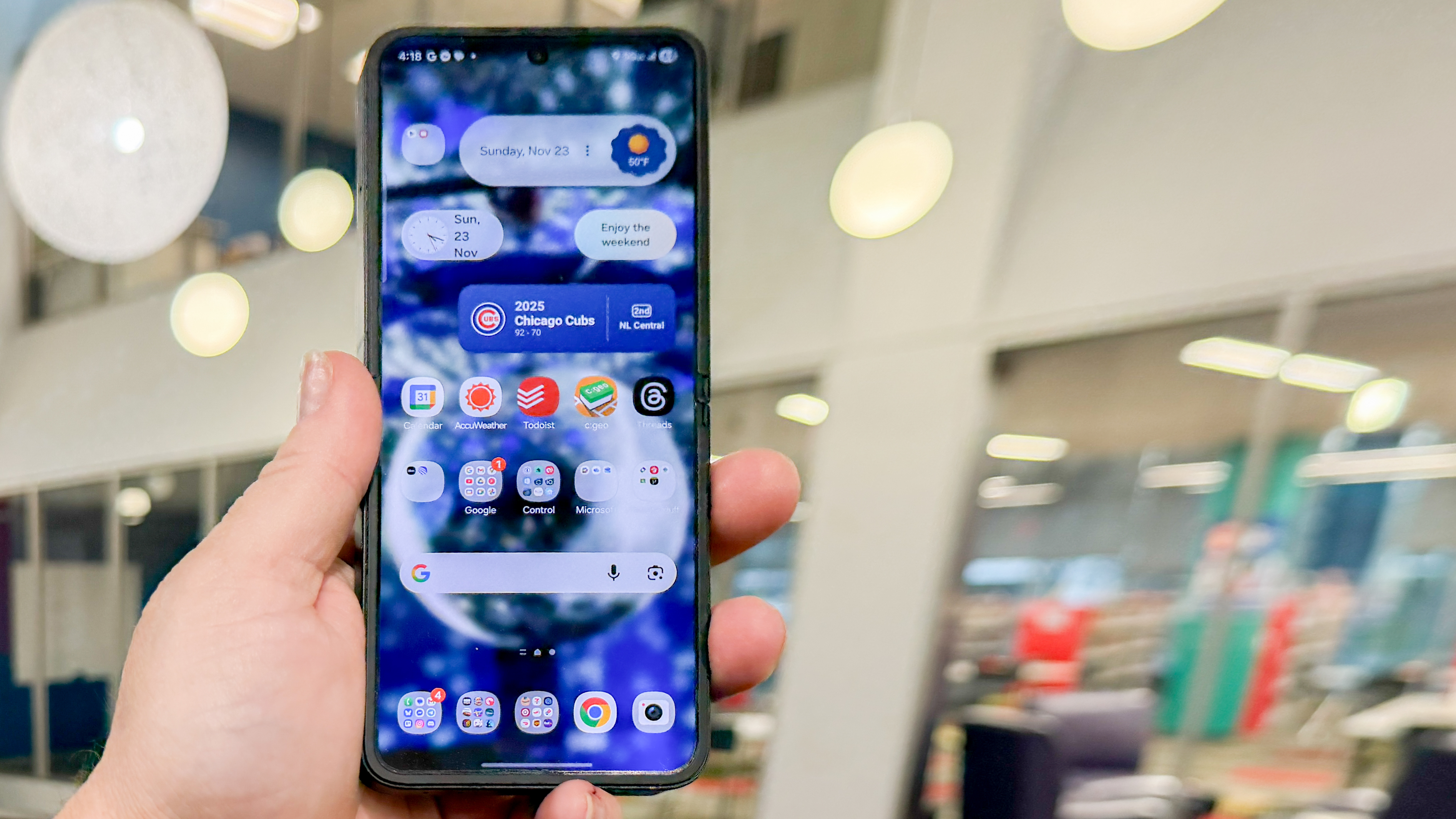 Samsung Galaxy Z Flip 7 FE in piano black color showing content on the cover display and the main screen