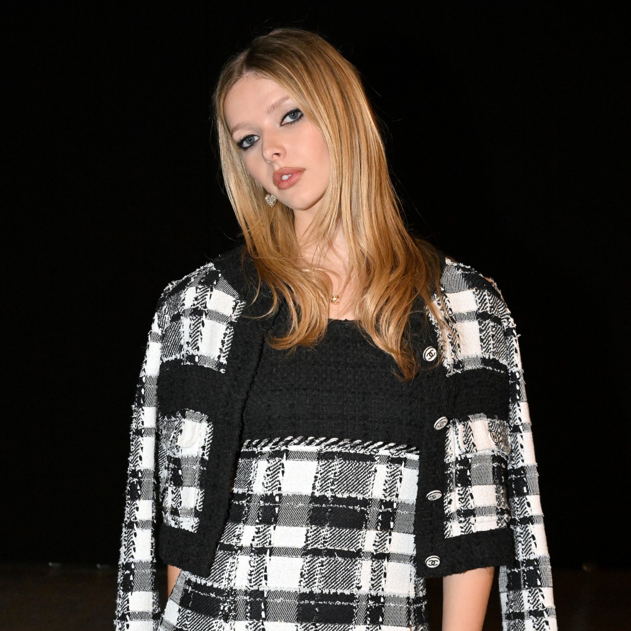 a paparazzi photo of a white woman with blonde hair