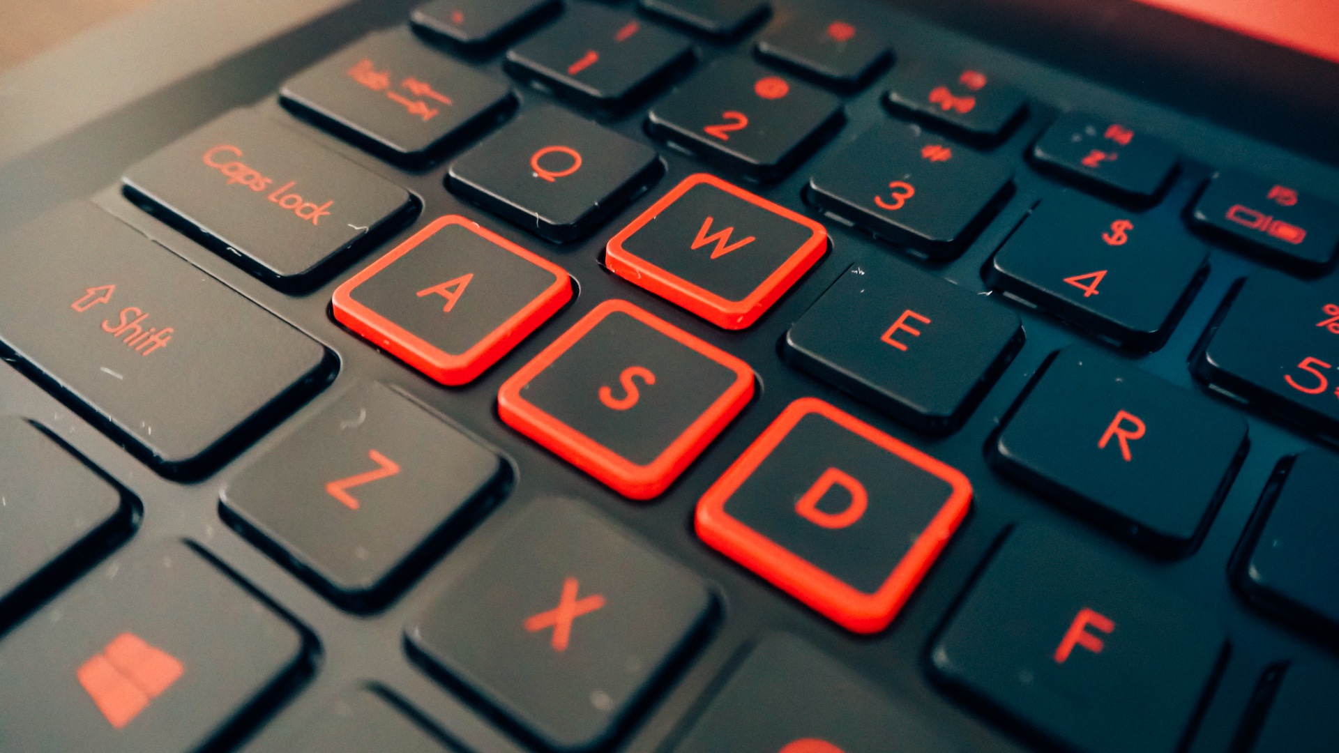 The WASD keys are emboldened in red paint.