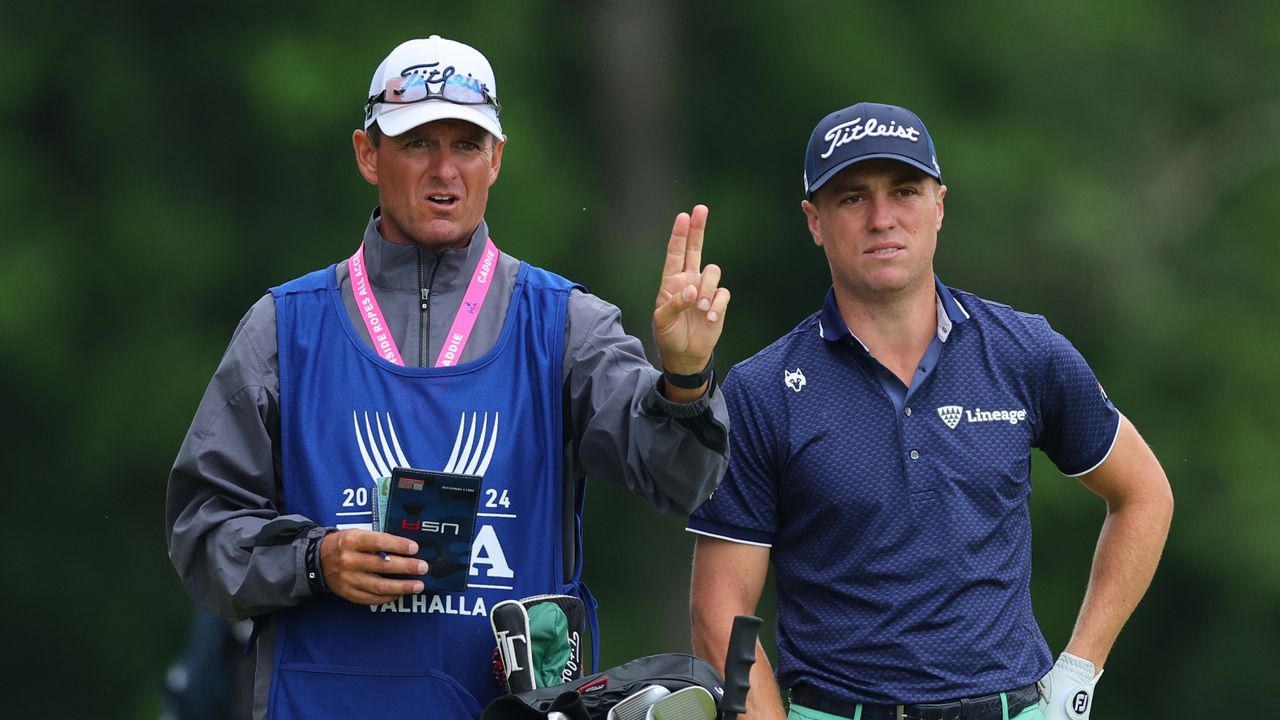 Justin Thomas of the United States talks with caddie Matt Minister on the fifth tee during the second round of the 2024 PGA Championship at Valhalla Golf Club on May 17, 2024 in Louisville, Kentucky.