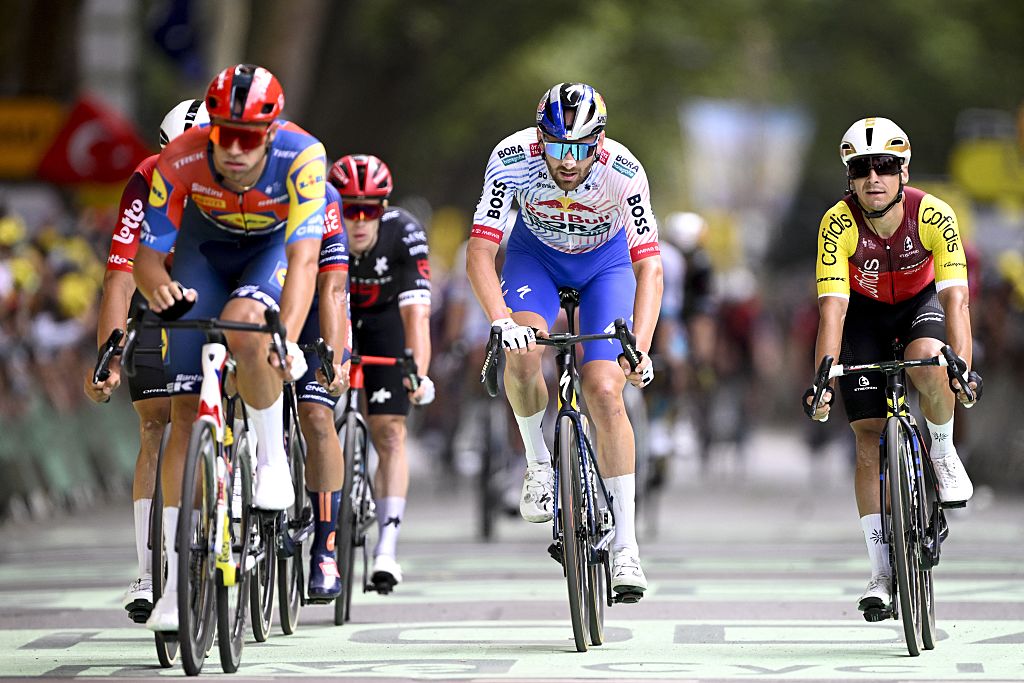 Italian Jonathan Milan of Lidl-Trek and Belgian Jordi Meeus of RedBull-BORA-hansgrohe pictured after the first stage, Lille Metropole to Lille Metropole (185 km), of the 2025 Tour de France cycling race, in Lille, France, on Saturday 05 July 2025. The 112th edition of the Tour de France starts on Saturday 5 July in Lille, France, and will finish in Paris, France on the 27th of July. BELGA PHOTO JASPER JACOBS (Photo by JASPER JACOBS / BELGA MAG / Belga via AFP)