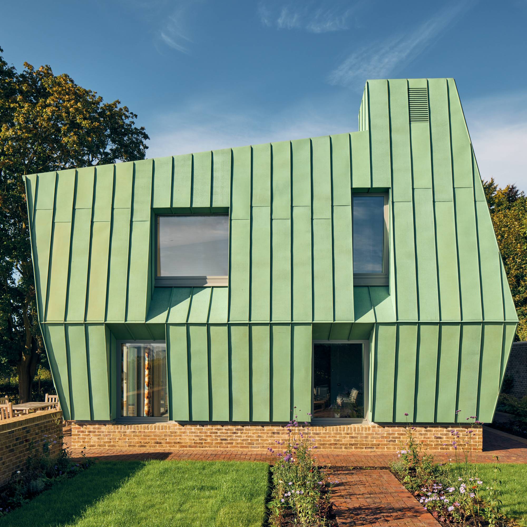 copper clad self build with small lawned garden