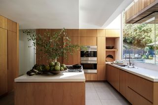 Modern wooden kitchen with large windows