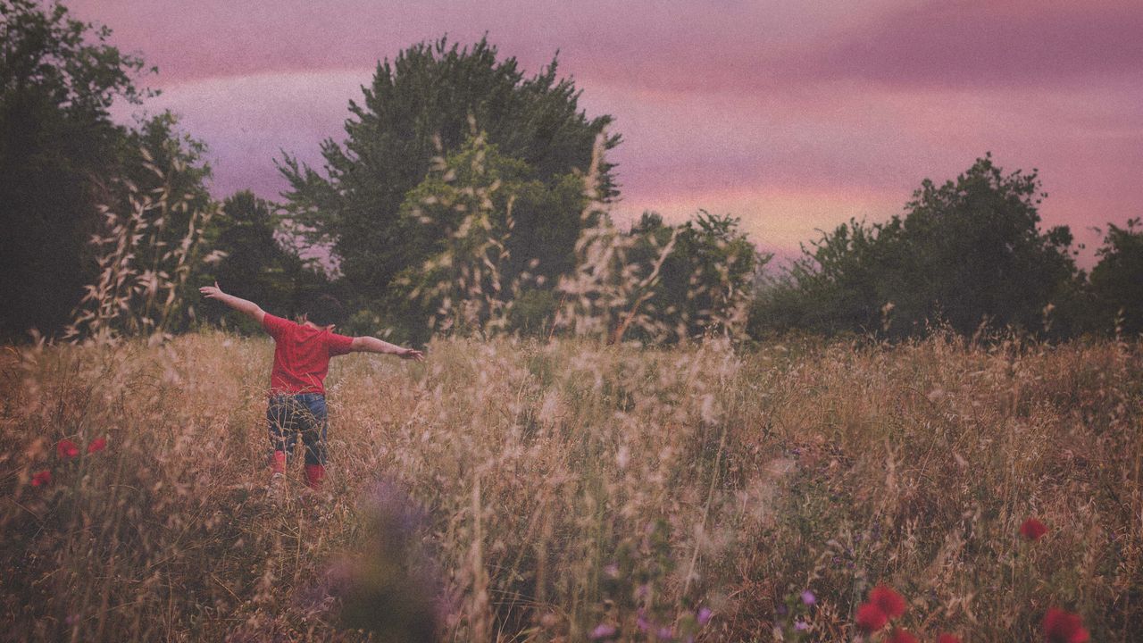 boy running in field