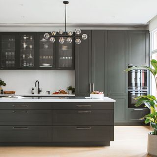 kitchen with wooden flooring and grey cabinets