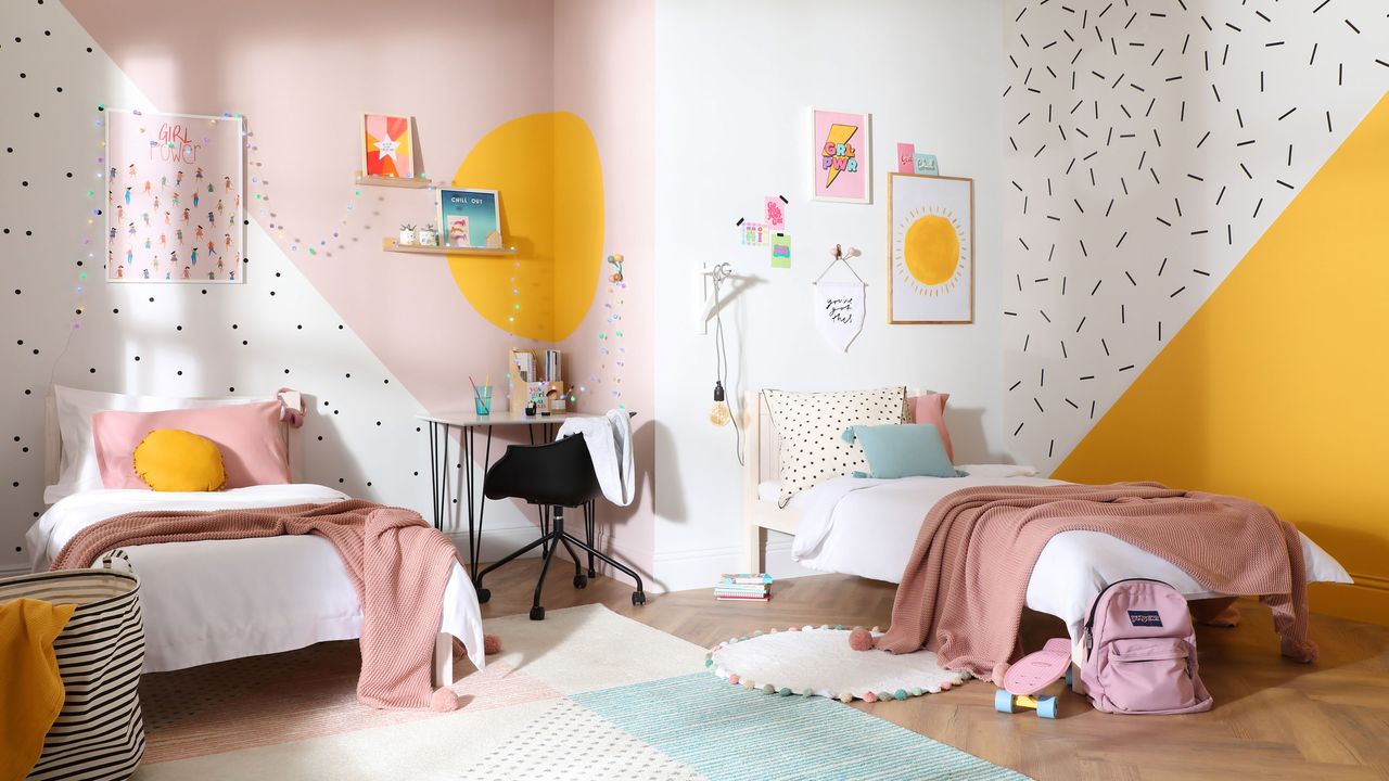 girls&#039; bedroom with yellow and pink walls