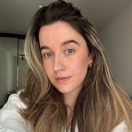 Deputy beauty editor Grace Lindsay taking a selfie with voluminous hair