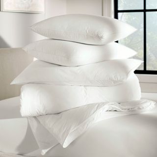 Three Boll & Branch Down Chamber Pillows stacked on top of each other 
