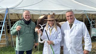 Helen Skelton with a cow and Rob and Dave Nicholson outside a marquee in the Westmorland County Show in Winter on the Farm.