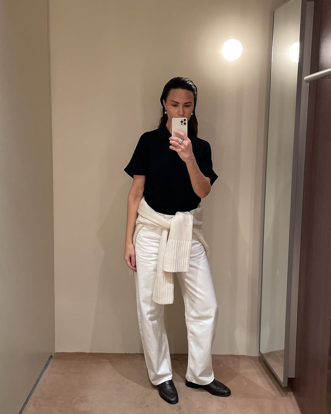 Woman wearing a sweater styling idea for 2025 in summer.