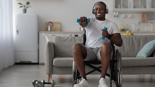Man in a wheelchair using dumbbells