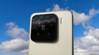 The Xiaomi 15's camera module against a blue sky