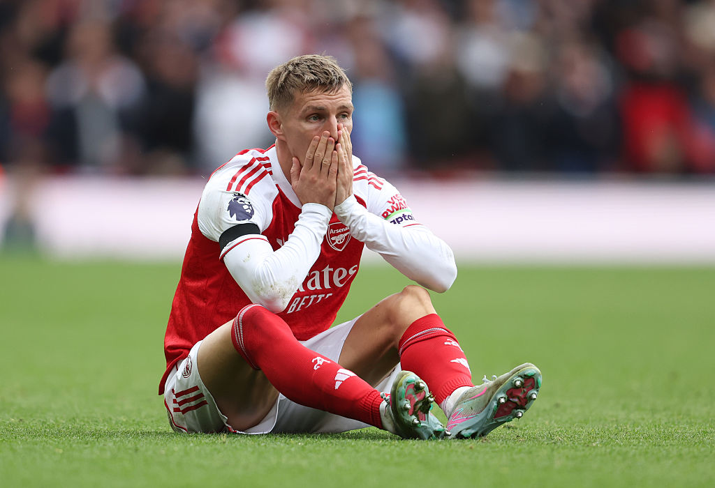 LONDON, ENGLAND - OCTOBER 4: Arsenal&amp;amp;apos;s Martin Odegaard sustains an injury during the Premier League match between Arsenal and West Ham United at Emirates Stadium on October 4, 2025 in London, England. (Photo by Rob Newell - CameraSport via Getty Images)