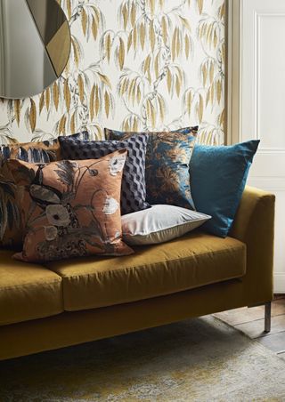 John Lewis Tiger's Eye wallpaper with mustard couch and decorative cushions