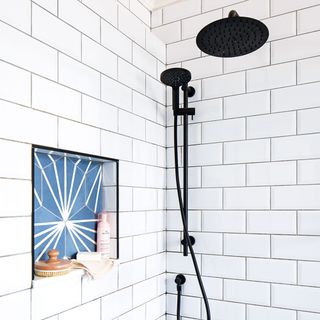 peach and blue bathroom with tiled shower