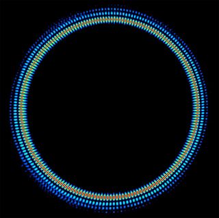 Here, a false-color image of a laser beam showing a superposition of entangled photons spinning in opposite directions. 