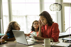 Mum trying to work from home with children around her