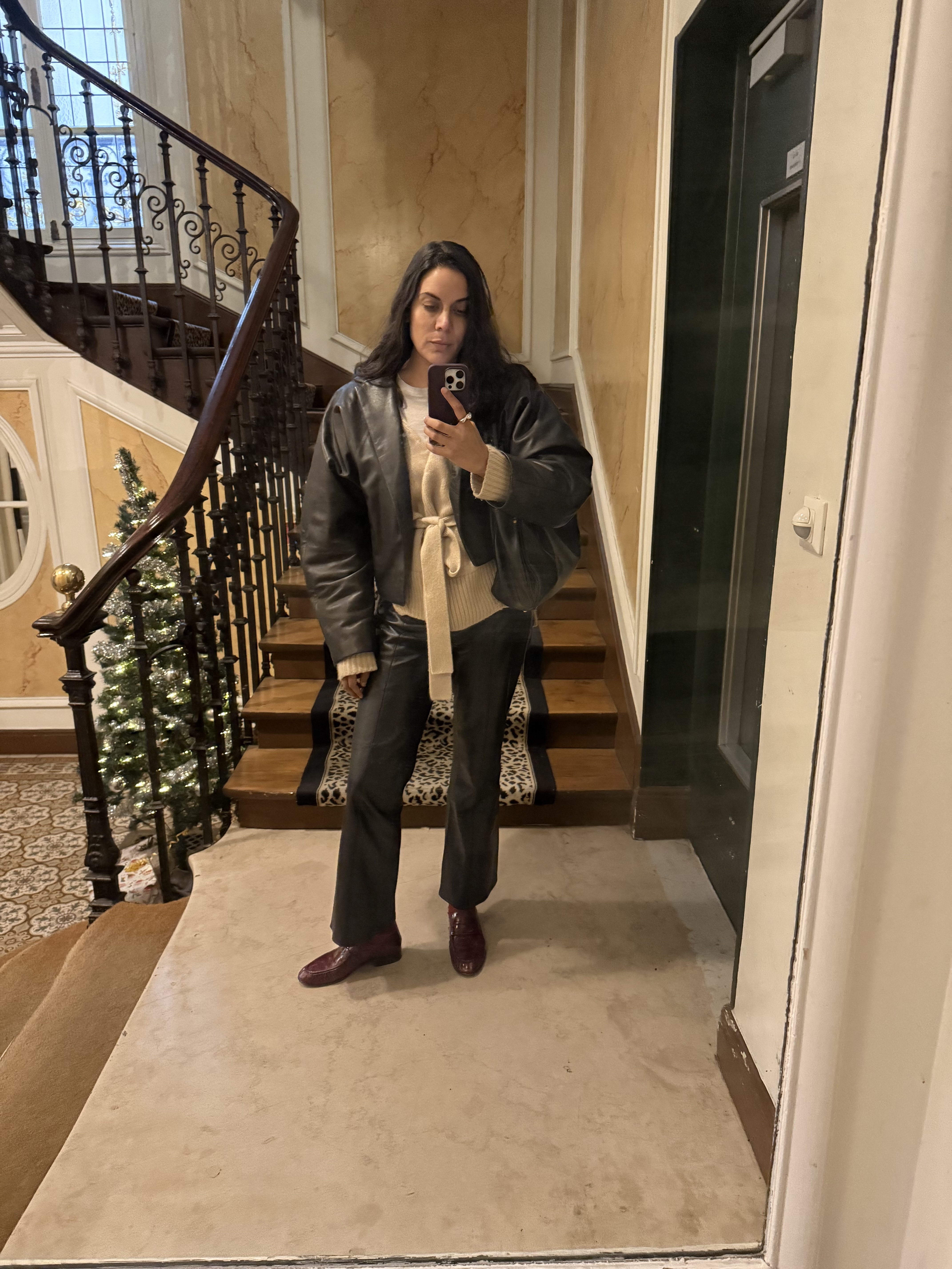 Noora Raj Brown in a selfie taken at the bottom of a staircase