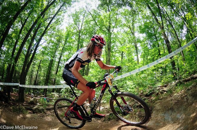Cypress Gorry (Whole Athlete) chasing on the uphill switchbacks