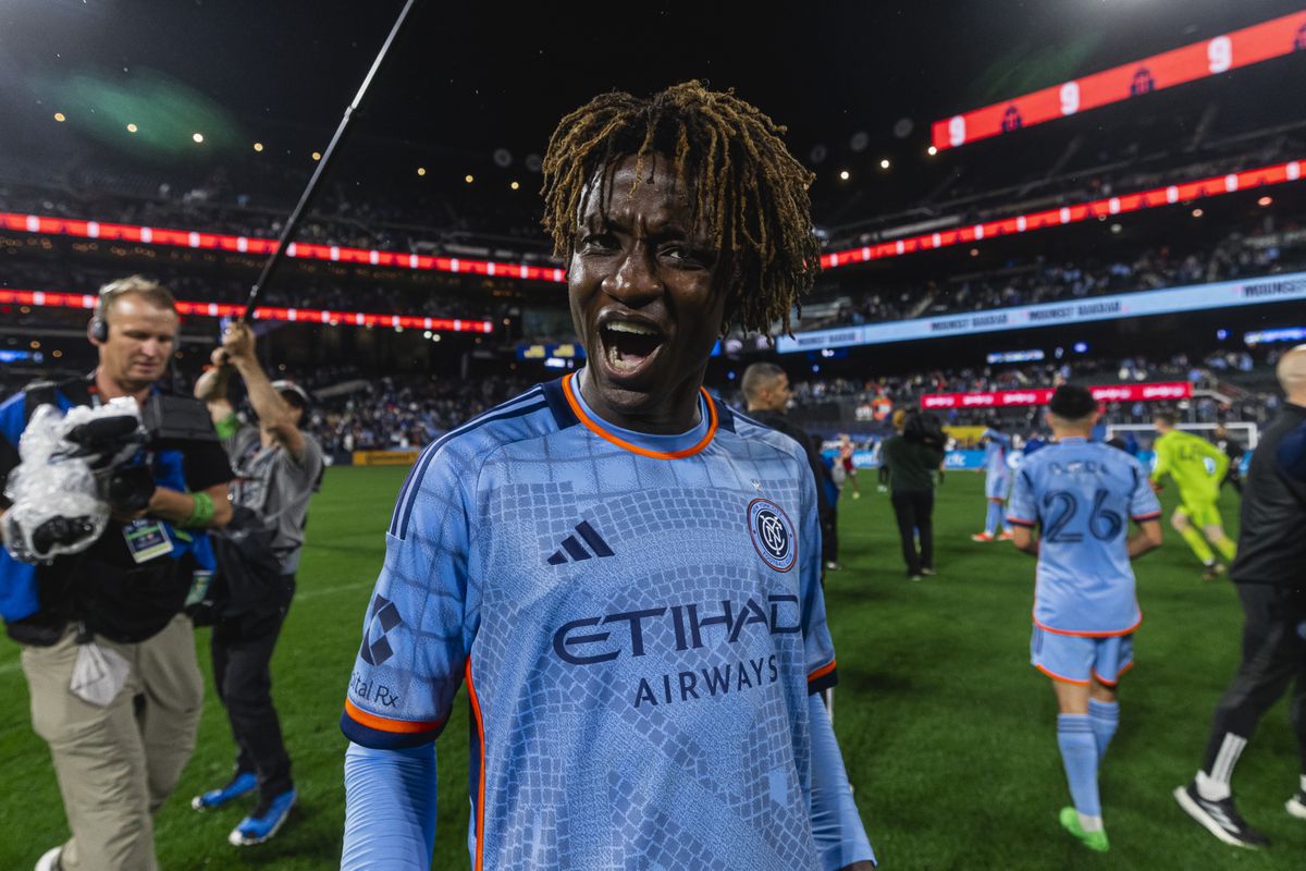 Malachi Jones screams at the camera at full-time of the Hudson River Derby
