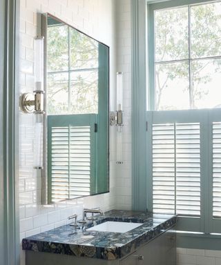 modern bathroom with painted window trim and shutters