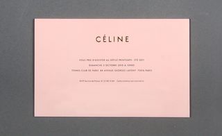 Back view of ﻿Céline's invitation pictured against a grey background
