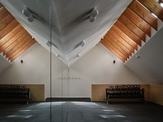 An exercise room is set above the garage