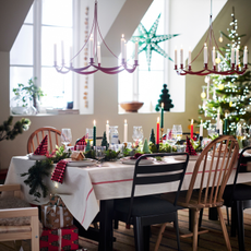 IKEA VINDERFINT Chandelier hanging above a festive dining table.