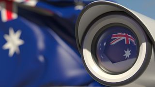 The Australian flag seen in the reflection of a CCTV camera