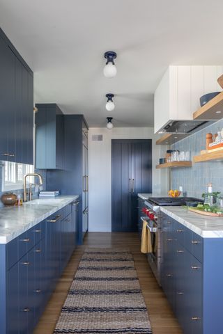 Small blue galley kitchen