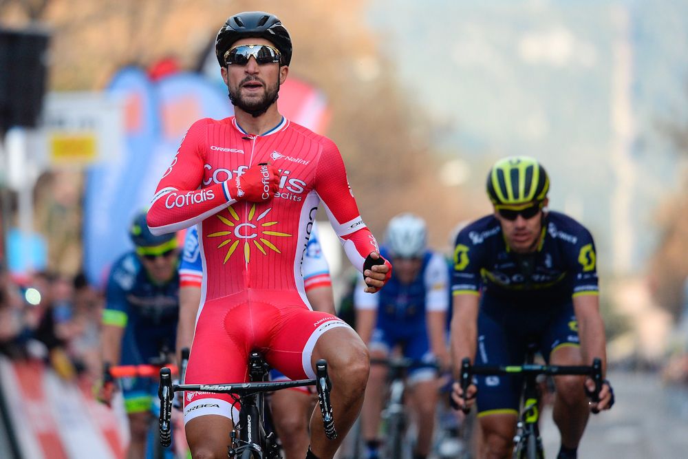 Cofidis' French cyclist Nacer Bouhanni celebrates as he crosses the finish line winning the fourth stage of the 97th Volta Catalunya