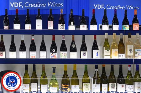 Rows of bottles of red and white wine, with 'VDF, Creative Wines' written above