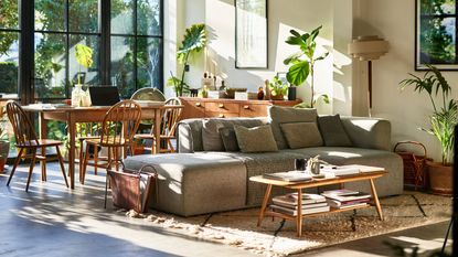 An example of what you can get in the Labor Day sales. Comfortable living room with sofa and coffee table, dining table and chairs, with patio doors leading into garden