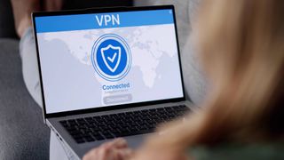 Woman Using VPN On laptop For Secure Online Browsing At Home